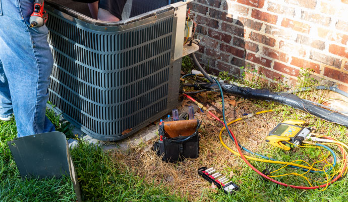 Experienced technician fixing ac