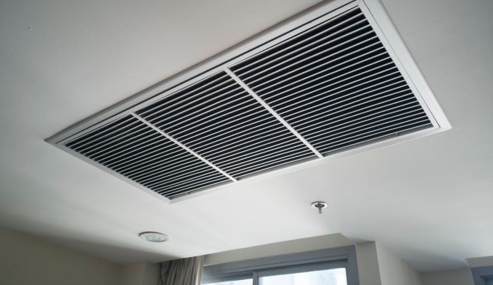 An air conditioning vent on a ceiling