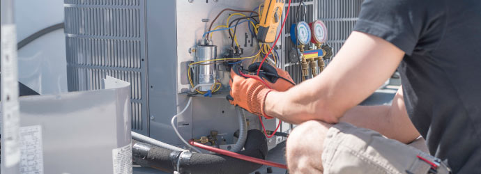 technician repairing ac