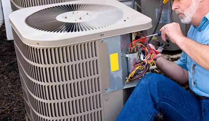 a professional repairing a heat pump