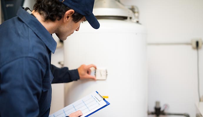 a professional inspecting a heater