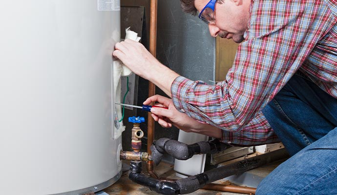 a professional servicing a heater