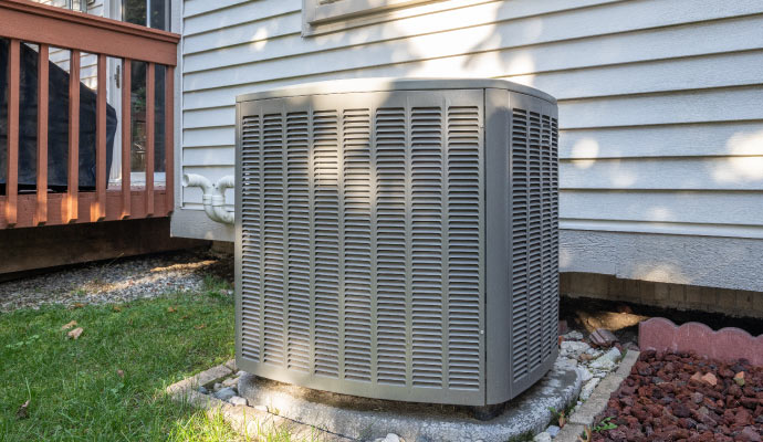 Outdoor heat pumps unit next to a house