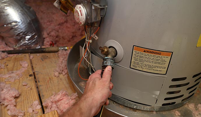 A person is repairing boiler