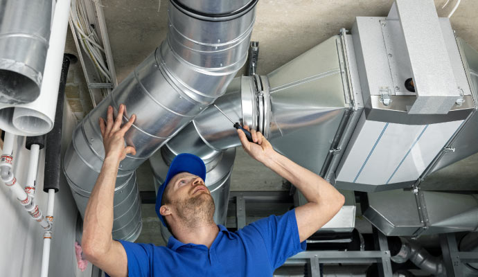 A technician is inspecting an HVAC system