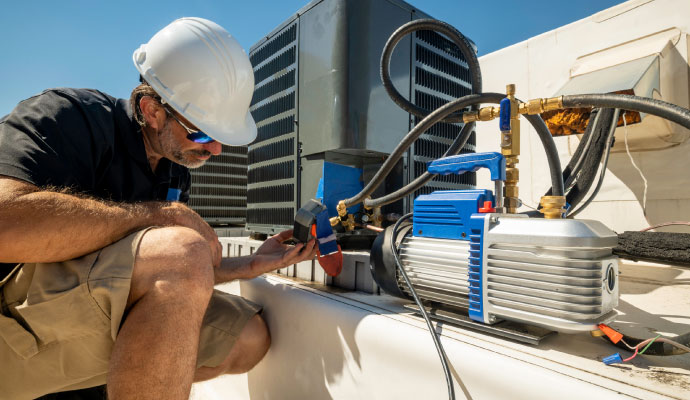 a professional worker inspecting hvac