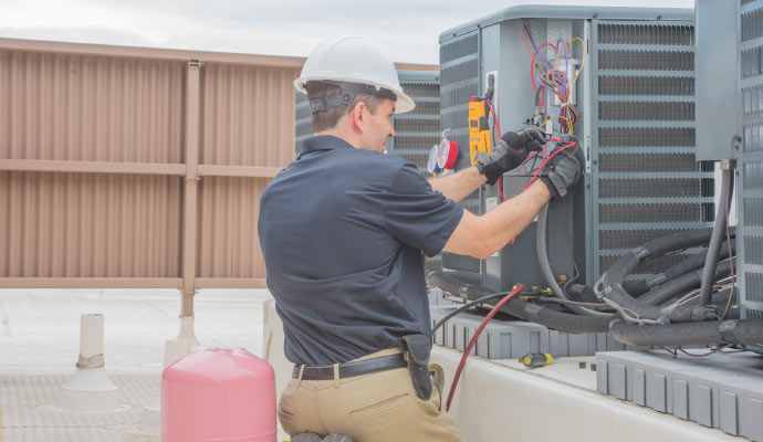 Professional repairing HVAC system