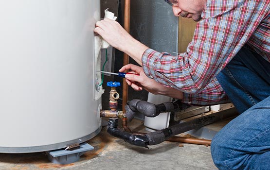 A worker replacing a heating system.